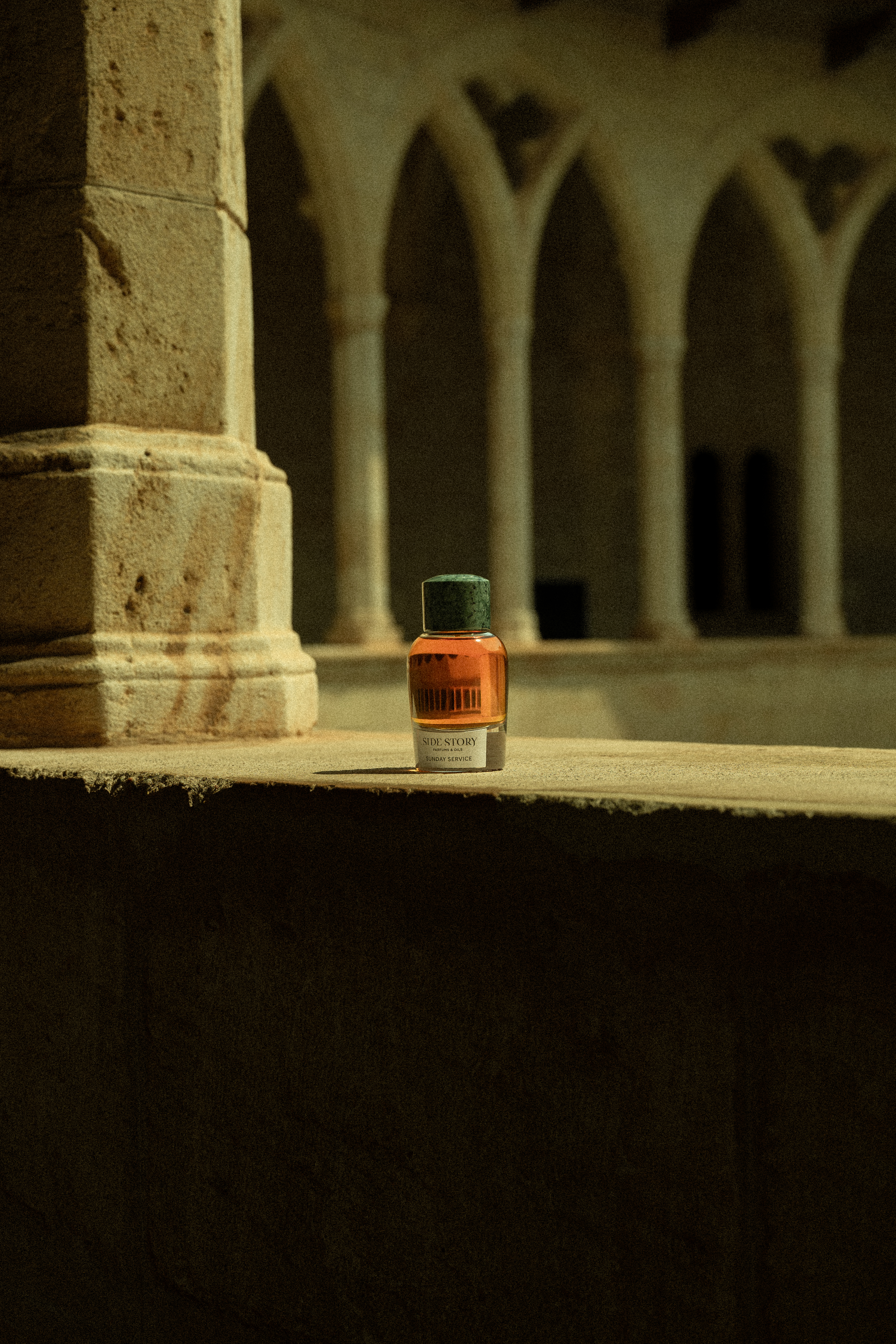 Side Story Sunday Service perfume in a sunlit cloister