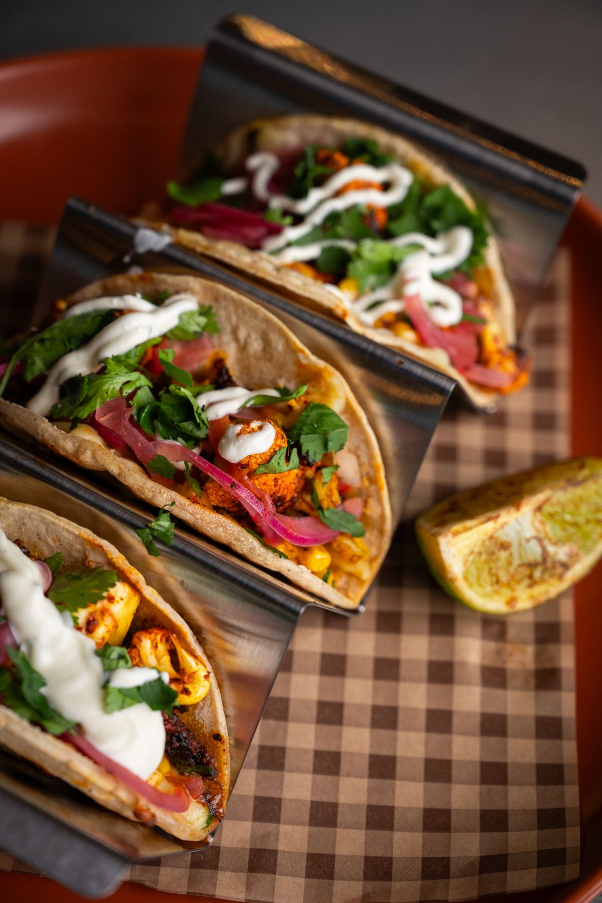 Lita cauliflower tacos in a steel rack